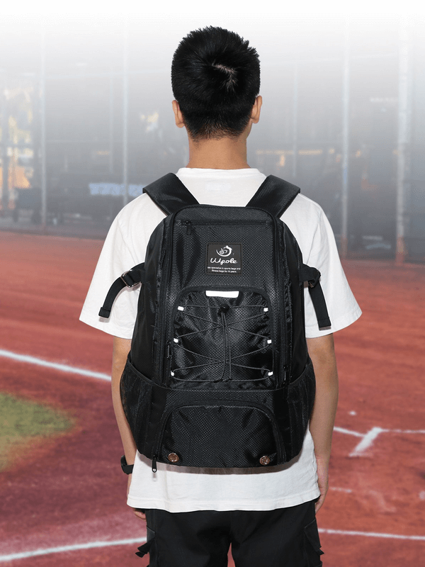 Unisex stylish sports backpack with spacious pockets, ideal for training, shown outdoors on a person wearing a white shirt on a track.